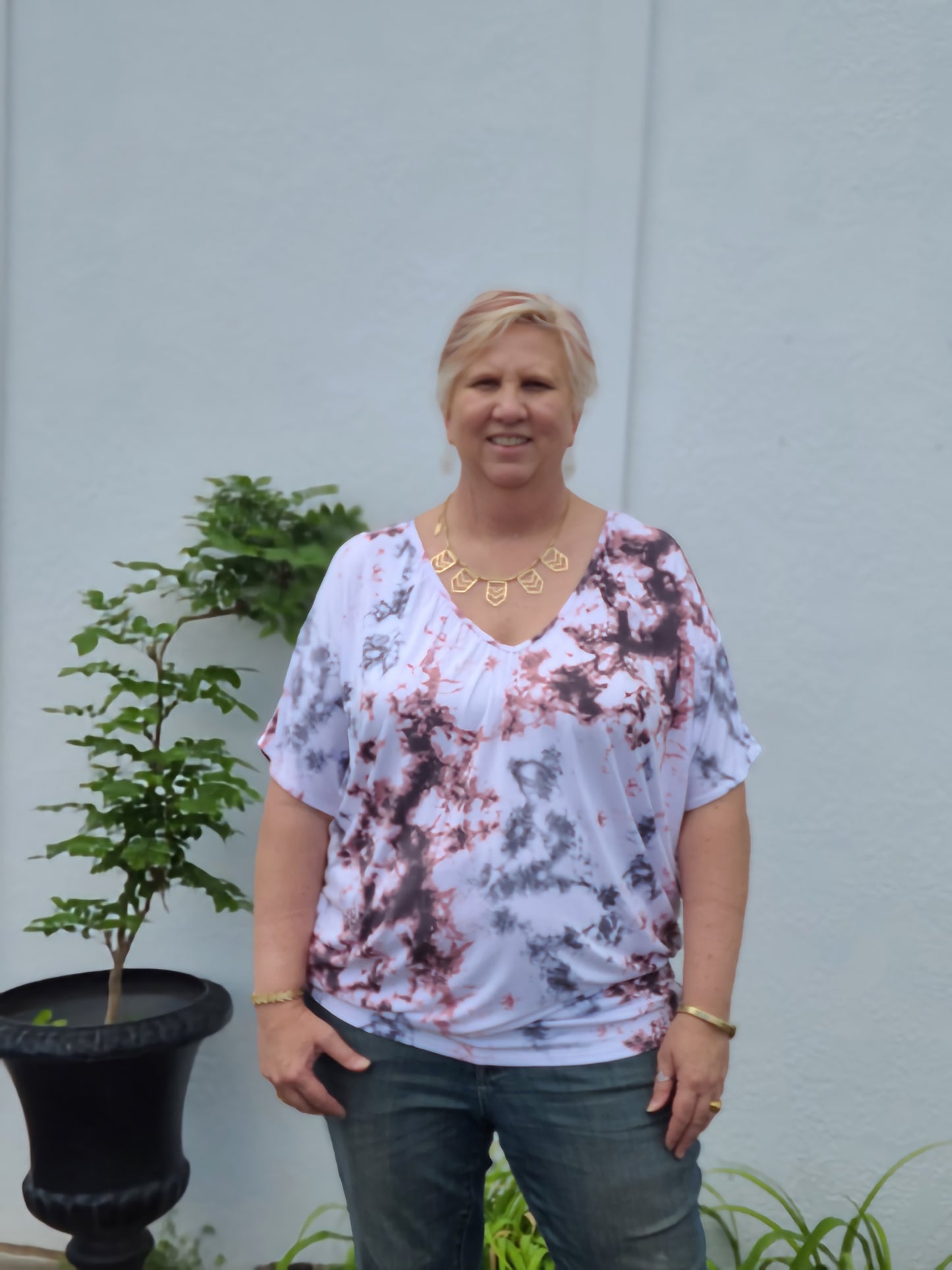 This gorgeous little tie dye dolman sleeve gem checks all the boxes for us with figure-flattering being one of the most important. This super soft top is made of comfortable stretch material and is a leggings-friendly length.