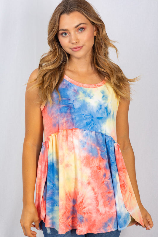 We are loving this tie dye top! It would pair perfectly with your favorite pair of shorts on nice summer day. This top includes a round neckline with reverse stitching, side slits and an empire waistline. The fabric is soft and comfortable.