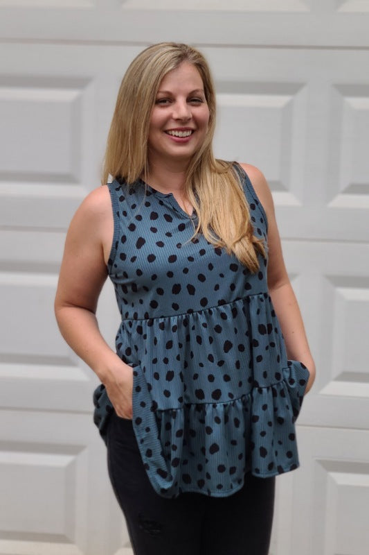 This is such a stylish top featuring a notch neckline, tiered ruffle hemline and relaxed silhouette. Easily pair with jeans or shorts. Style yourself with a casual-chic work-to-weekend look!
