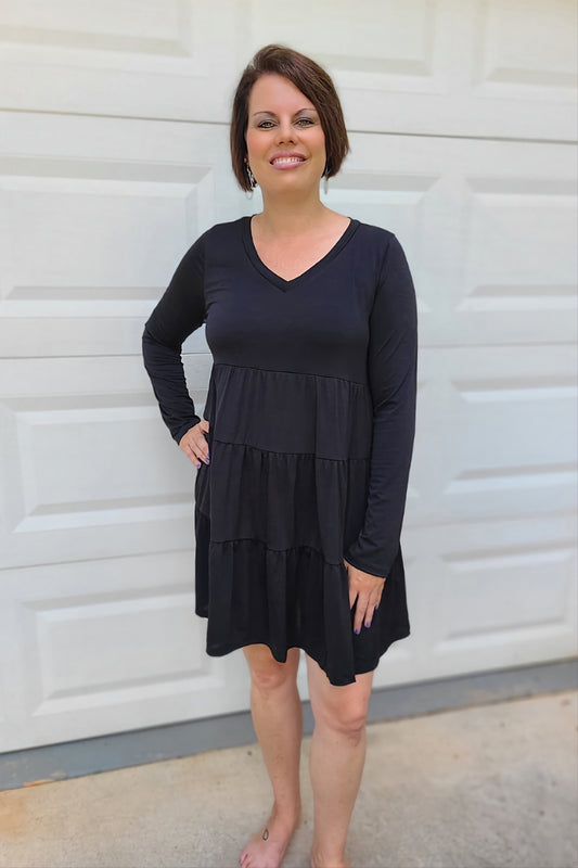 This tiered dress is an easy-to-wear option. Made from our favorite Bulgari wrinkle-free fabric. It's easily a staple piece in any wardrobe. The versatility of this dress is unmatched.