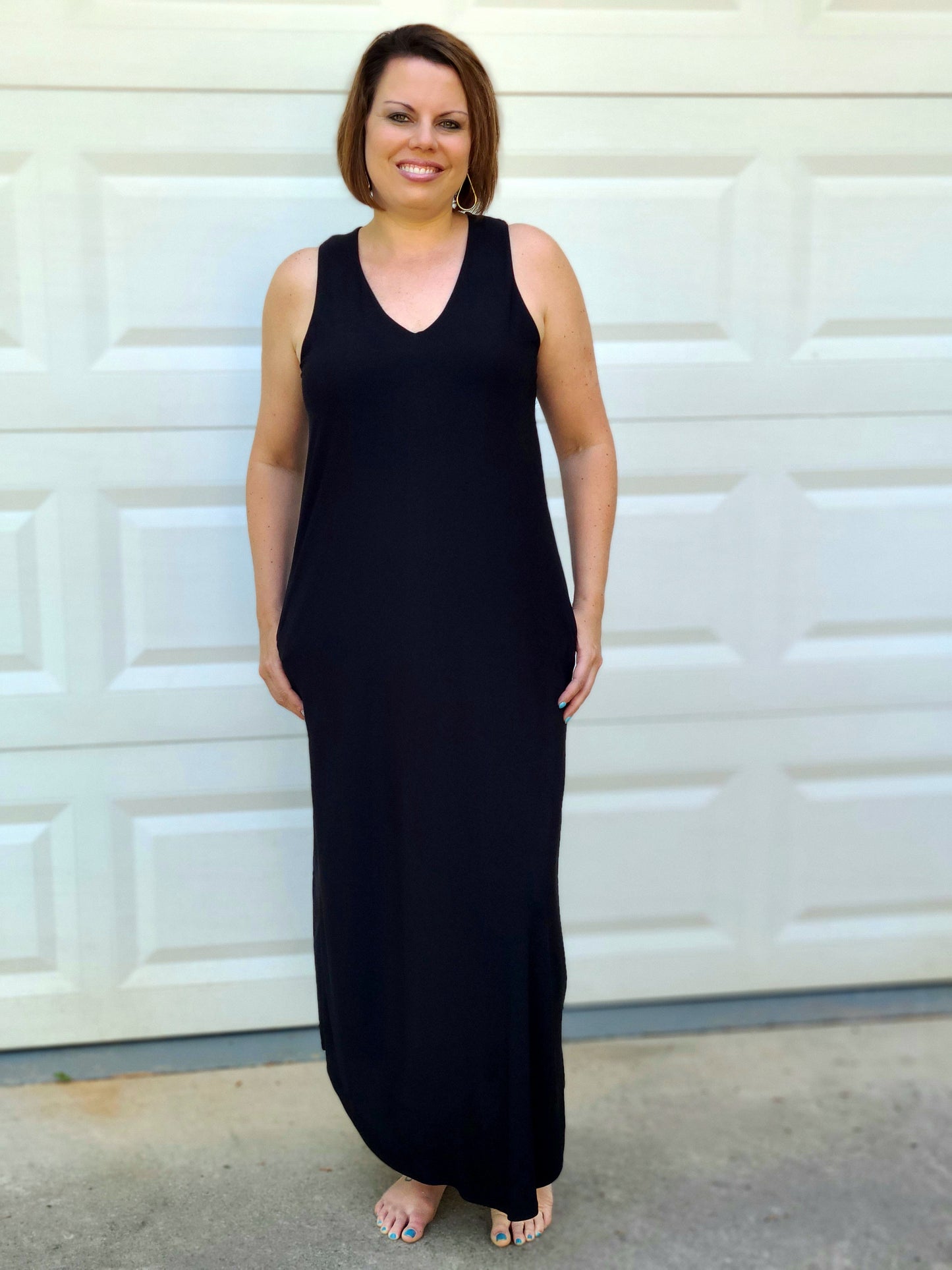 This gorgeous maxi dress is a must-have for any afternoon out with your BFFs. We love the classic black color - it's so chic and easy to dress up or down! The bodice features a v-neckline, side pockets and is so soft and comfortable. You can dress it up with edges and a floppy hot for vacation days!
