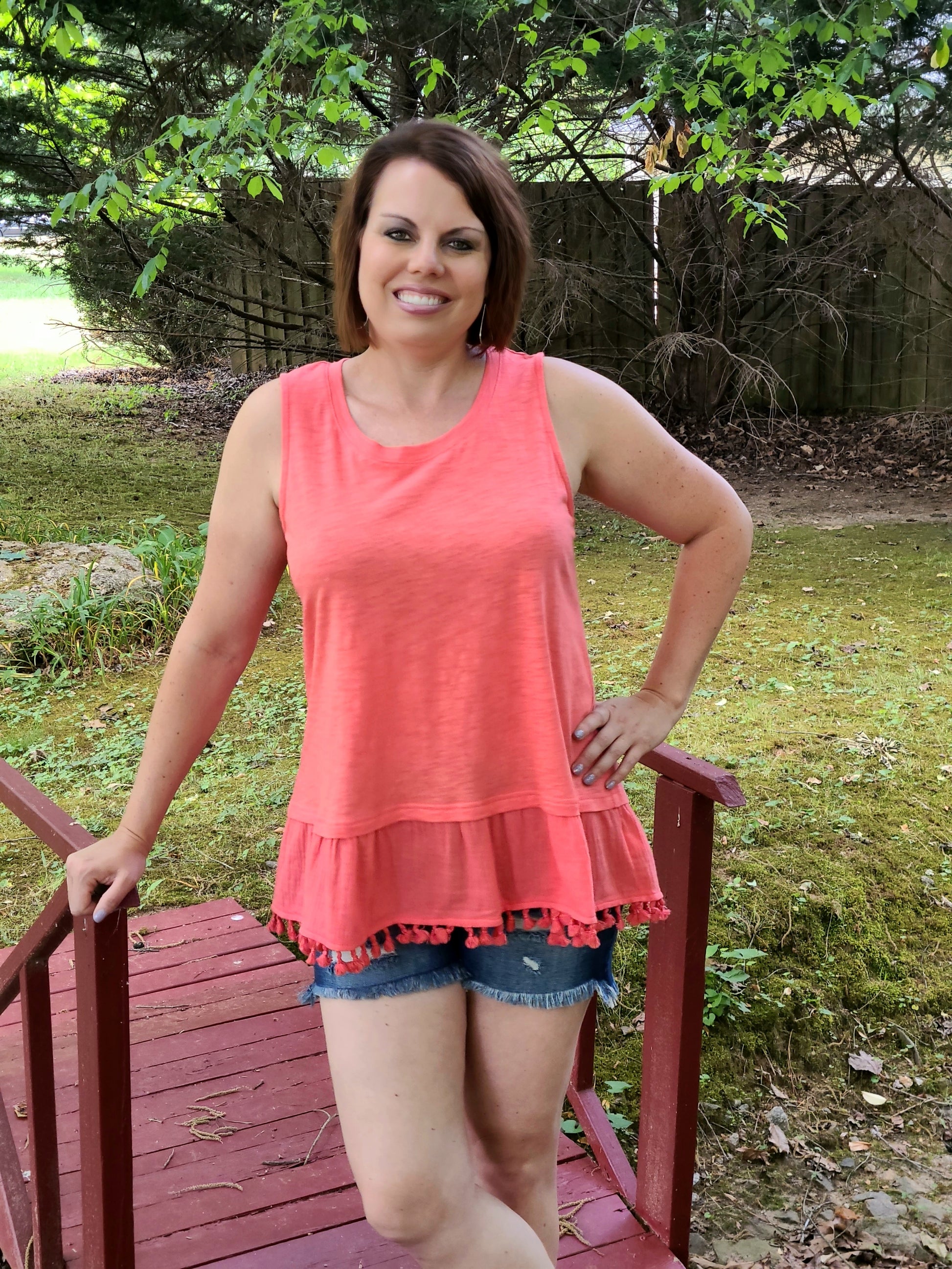 In a softened slub fabric, this timeless tank gets a free-spirited edge by way of the fringe hem detail that it has. It also includes a round neckline and is so soft and comfortable.