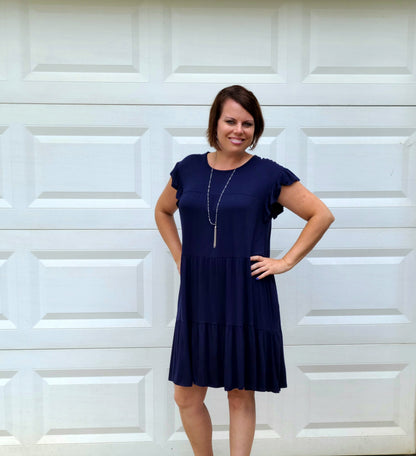 This adorable dress will get you through any day of the week! This dress includes a round neckline, short ruffle sleeves, ruffle tiered body, pockets and an amazing color.