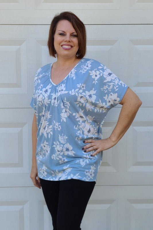 Florals have a way of bringing out the inner romantic in all of us. Pieces that are filled with whimsy and wonder are some of our very favorite to wear! This gorgeous little dolman sleeve gem checks all the boxes for us with figure-flattering being one of the most important. This super soft top is made of comfortable stretch material and is a leggings-friendly length.