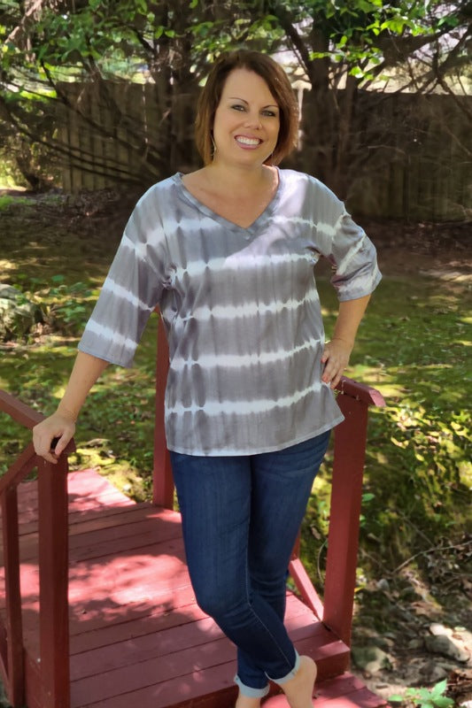 This top is to "dye" for! It features a lightweight breezy material, half sleeves and a v-neckline. It's the perfect top to pair with your favorite pair of jeans or shor