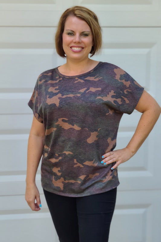 This top is so cute! It is the perfect transition piece into fall and can be worn with your favorite pair of jeans. It features a round neckline, a twisted open back with a round hemline and is so soft and comfortable.