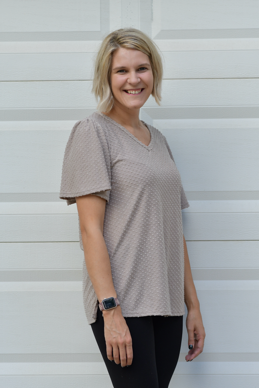 This top is so cute! It's perfect for a day at work or a night on the town. This top features a v-neckline, side slits, flutter sleeves and is so soft and comfortable.