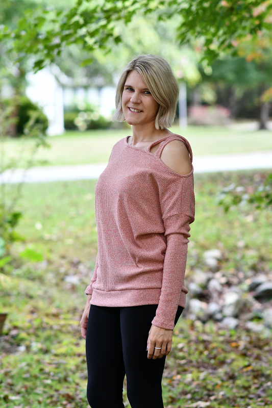This top is so cute and would pair perfectly with your favorite pair of jeans on a cool Fall day! The details include a strappy shoulder and a tapered waist. The fabric is a lightweight textured ribbed knit.