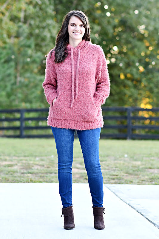 This hoodie is perfect for a cozy day! This top features a large kangaroo pocket and drawstring detail. The fabric is soft and comfortable.