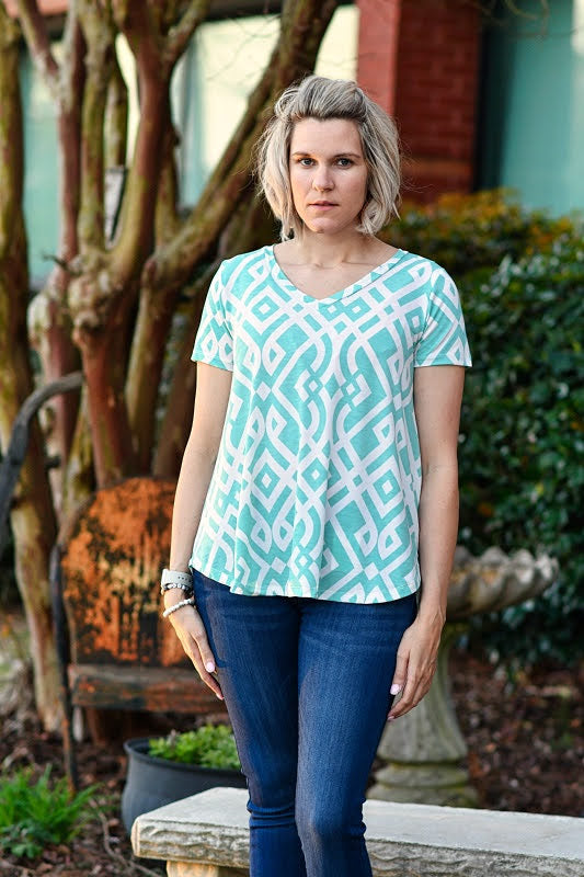 This adorable top is the perfect throw on and go top for work or a nice spring day! The details include a v-neckline, short sleeves, rounded hemline, and is made of a lightweight material.