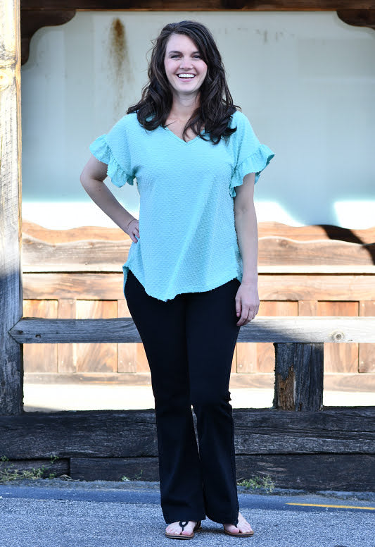 Swiss dot is trending big this season along with all the feminine details like ruffles, and this top has it all! The details include a v-neckline, ruffle sleeves and is so soft and comfortable.