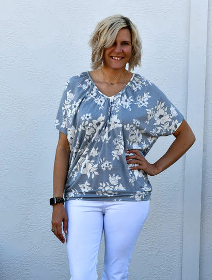 Florals have a way of bringing out the inner romantic in all of us. Pieces that are filled with whimsy and wonder are some of our very favorite to wear! This gorgeous little dolman sleeve gem checks all the boxes for us with figure-flattering being one of the most important. This super soft top is made of comfortable stretch material and is a leggings-friendly length.